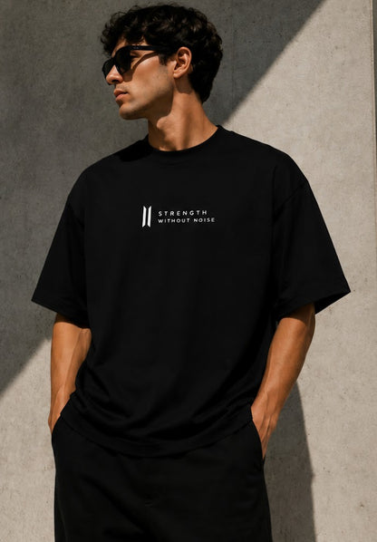 Male model wearing MARLEAU sTRENGTH WITHOUT NOISE OVERSIZED BLACK T-SHIRT